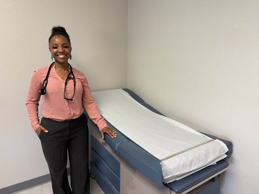 Dr. Shauntelle Bonman Senkungu in an exam room